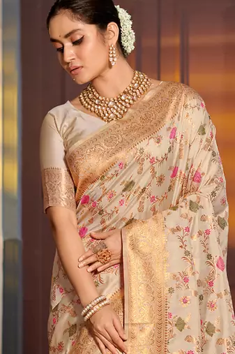 Graceful white banarasi silk blend saree with golden zari woven border & floral jaal     wedding & festive wear