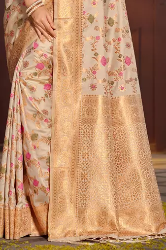 Graceful white banarasi silk blend saree with golden zari woven border & floral jaal     wedding & festive wear