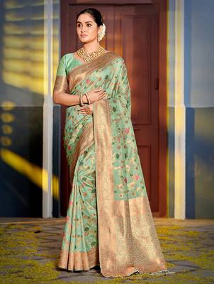 sea green banarasi silk blend saree with golden zari woven border 1