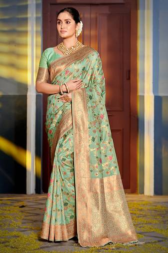 Graceful sea green banarasi silk blend saree with golden zari woven border & floral jaal     wedding & festive wear