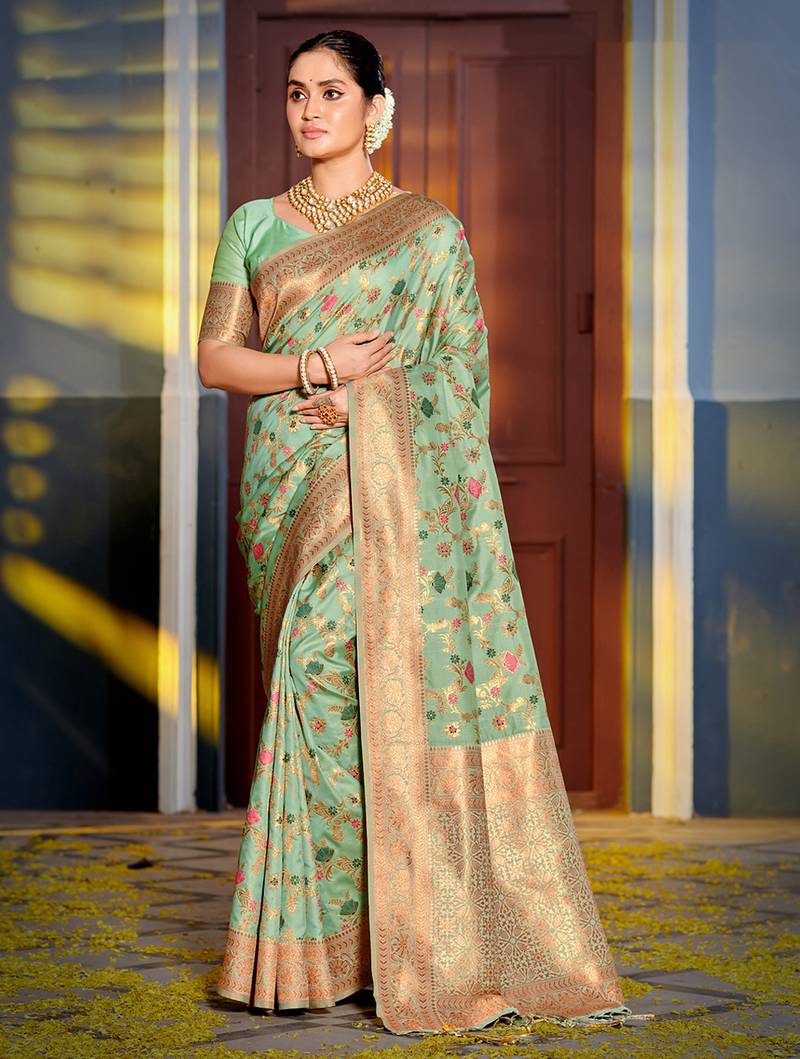 Graceful sea green banarasi silk blend saree with golden zari woven border & floral jaal     wedding & festive wear