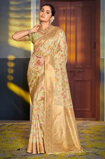 Graceful light green banarasi silk blend saree with golden zari woven border & floral jaal     wedding & festive wear