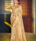Graceful light green banarasi silk blend saree with golden zari woven border & floral jaal     wedding & festive wear