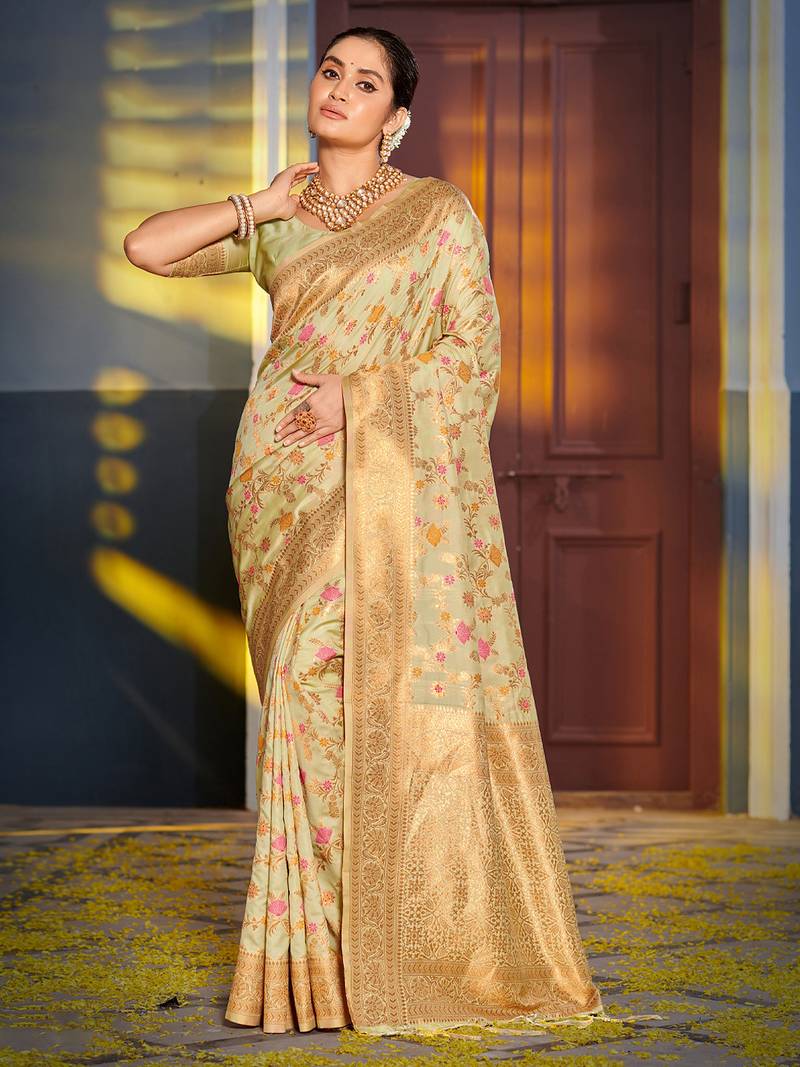 Graceful light green banarasi silk blend saree with golden zari woven border & floral jaal     wedding & festive wear