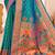 Sea green kanjivaram silk blend saree with golden zari and colorful peacock woven pallu design