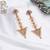 Abhika creations gold-toned floral top triangle dangler earrings with pearl detailing