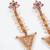 Abhika creations gold-toned floral top triangle dangler earrings with pearl detailing