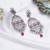 Abhika creations antique silver peacock drop earrings with pink stone & pearl cluster