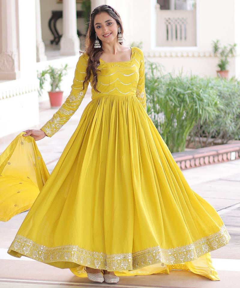 Yellow color vichitra silk fabric glamorous ceremonial gown for wedding looks