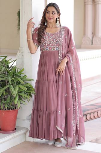 Peach color faux georgette fabric glamorous ceremonial gown for wedding looks