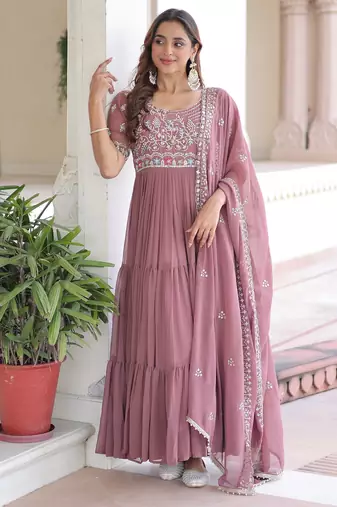 Peach color faux georgette fabric glamorous ceremonial gown for wedding looks