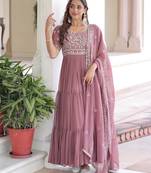 Peach color faux georgette fabric glamorous ceremonial gown for wedding looks