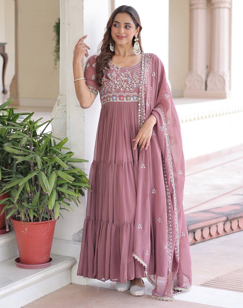 Peach color faux georgette fabric glamorous ceremonial gown for wedding looks