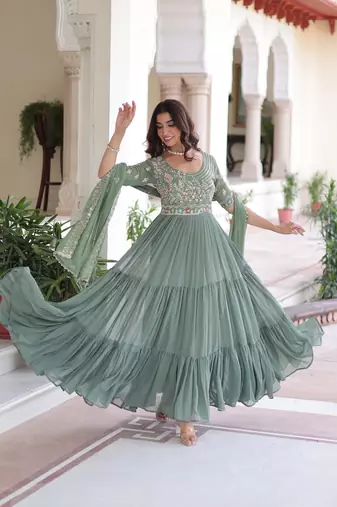 Green color faux georgette fabric glamorous ceremonial gown for wedding looks