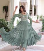 Green color faux georgette fabric glamorous ceremonial gown for wedding looks