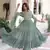 Green color faux georgette fabric glamorous ceremonial gown for wedding looks