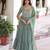 Green color faux georgette fabric glamorous ceremonial gown for wedding looks
