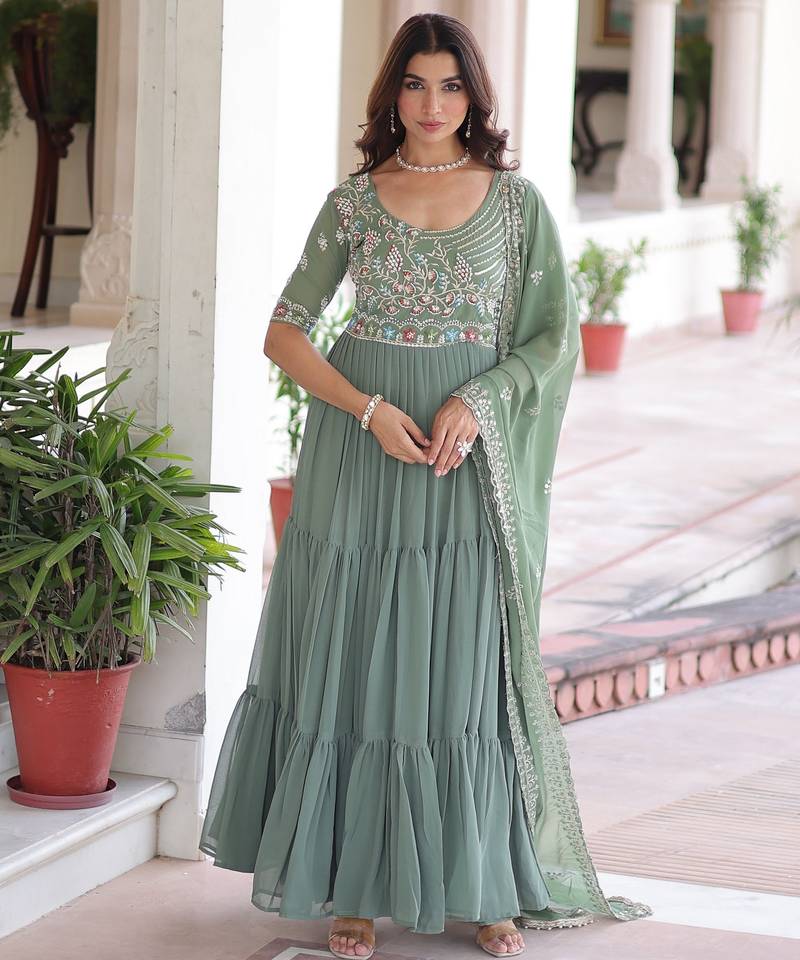 Green color faux georgette fabric glamorous ceremonial gown for wedding looks