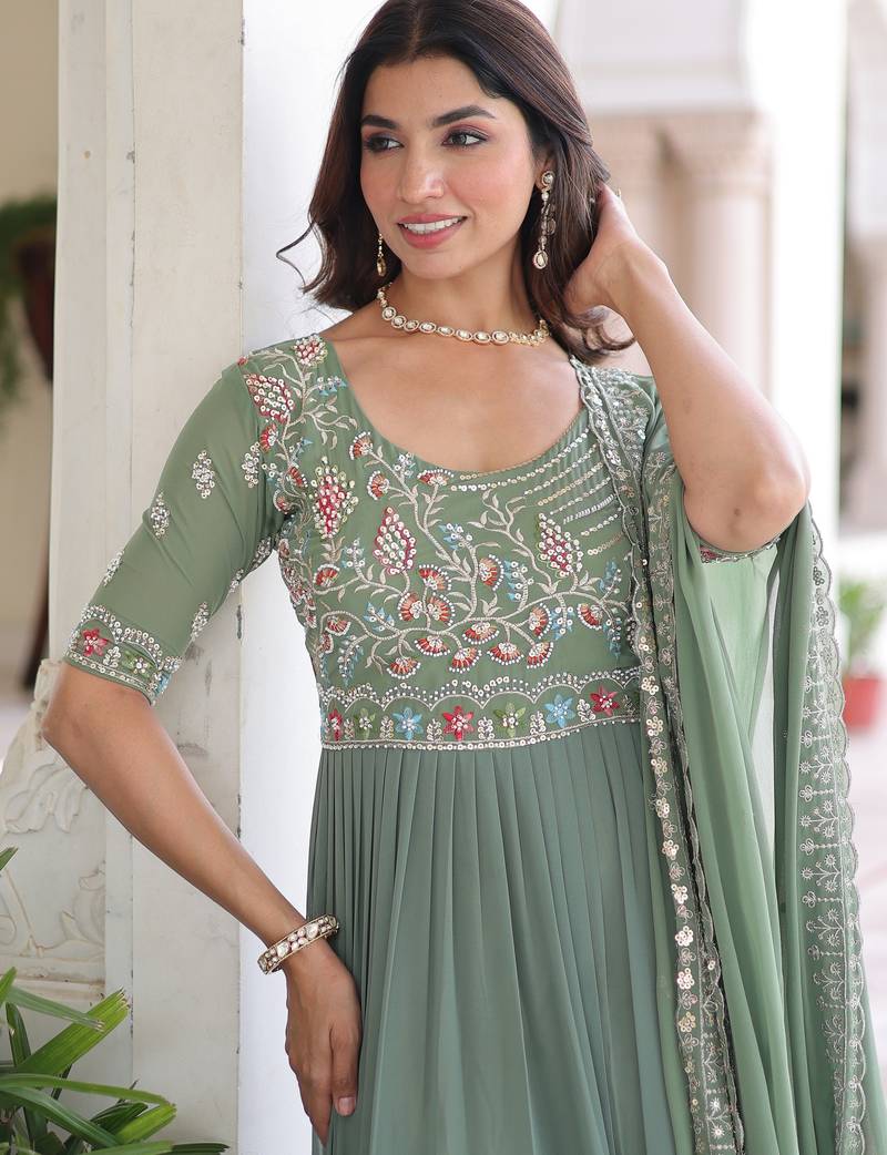 Green color faux georgette fabric glamorous ceremonial gown for wedding looks