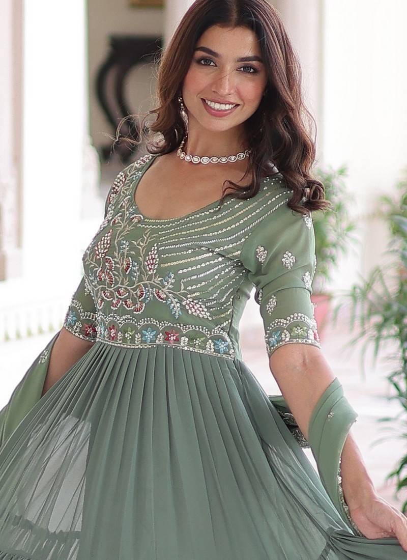 Green color faux georgette fabric glamorous ceremonial gown for wedding looks