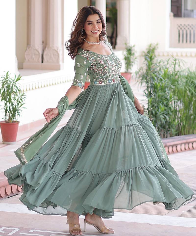 Green color faux georgette fabric glamorous ceremonial gown for wedding looks
