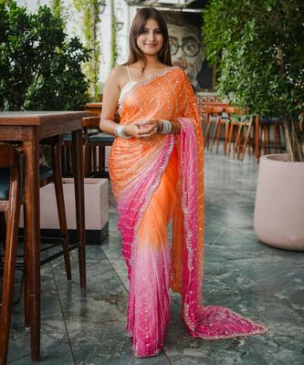 orange trendy satin pedding with beads hand work saree 1