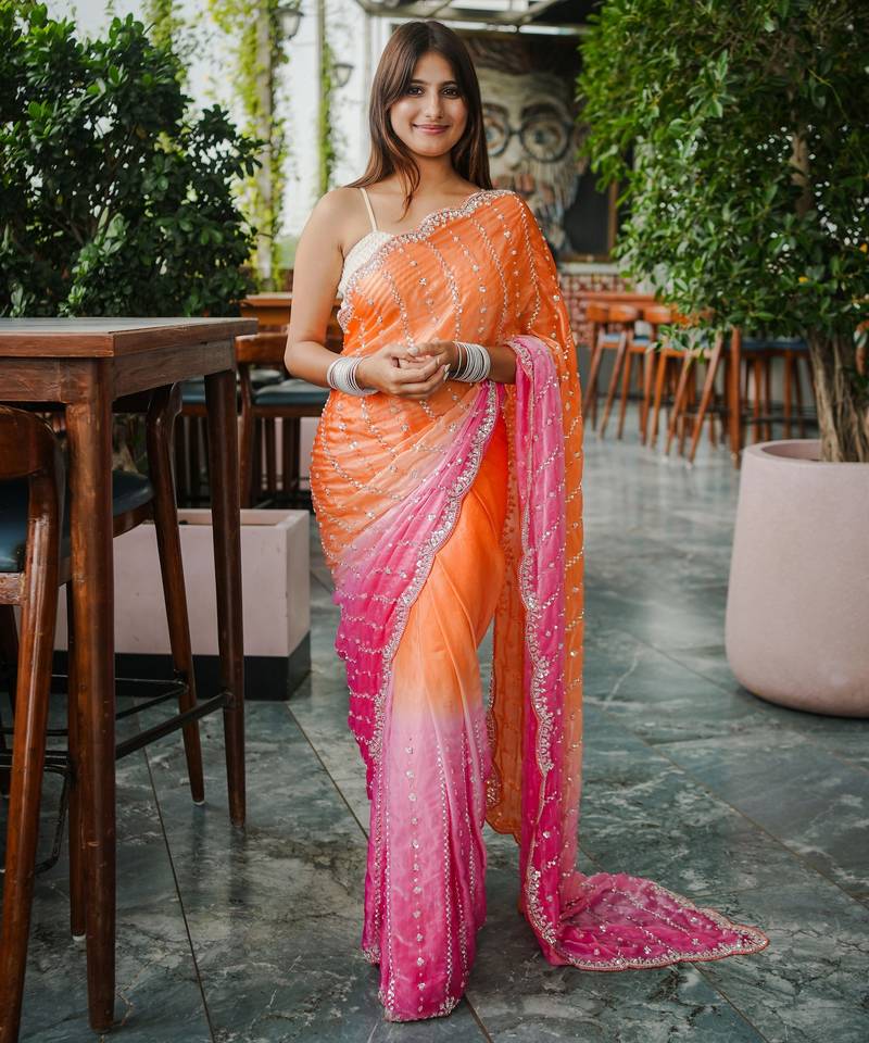 orange color trendy fendy satin fabric pedding with beads hand work saree