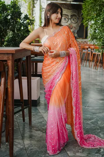 orange trendy satin pedding with beads hand work saree