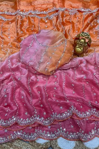 orange trendy satin pedding with beads hand work saree