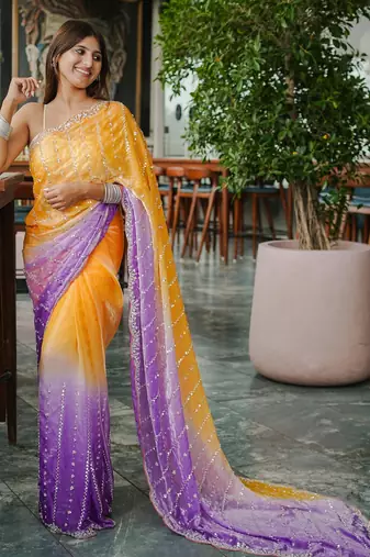 yellow trendy satin pedding with beads hand work saree