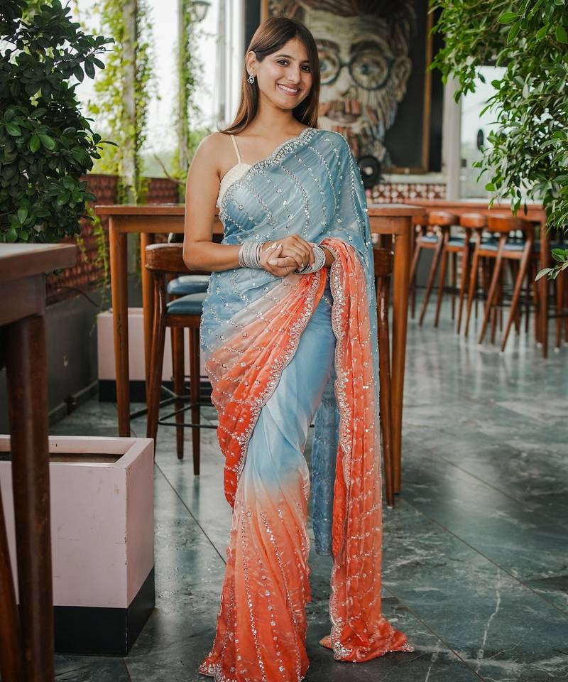 blue color trendy fendy satin fabric pedding with beads hand work saree