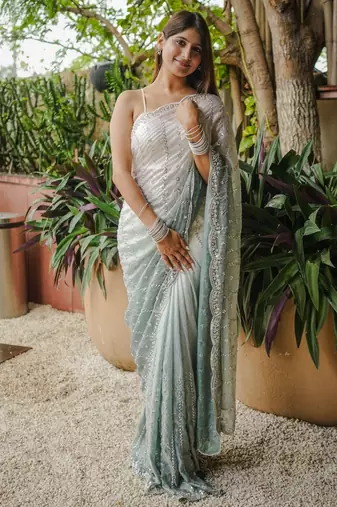 white color trendy fendy satin fabric pedding with beads hand work saree