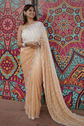 peach color trendy fendy satin fabric pedding with beads hand work saree