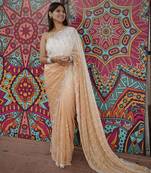 peach color trendy fendy satin fabric pedding with beads hand work saree