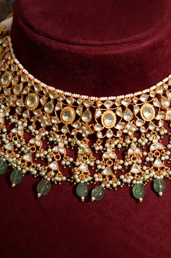Gold plated kundan green stones necklace set