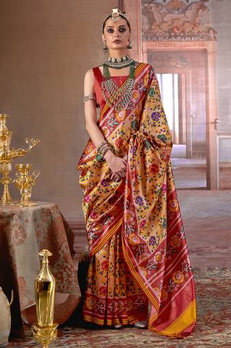 yellow art silk blend patola print saree with red blouse