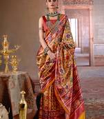 yellow art silk blend patola print saree with red blouse