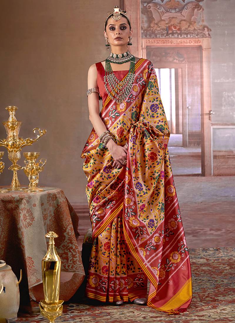 yellow art silk blend patola print saree with red blouse