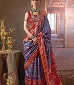 navy blue art silk blend patola print saree with red blouse
