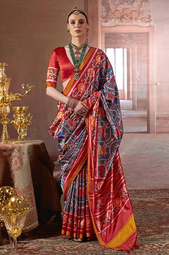 teal art silk blend patola print saree with red blouse