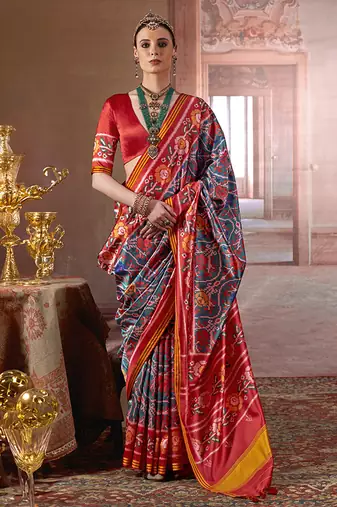 teal art silk blend patola print saree with red blouse
