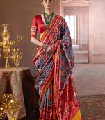 teal art silk blend patola print saree with red blouse