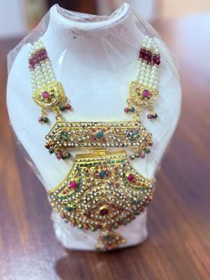 Golden necklace with green stone work  and kundan work 1
