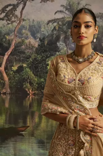 cream net embroidered lehenga choli with dupatta
