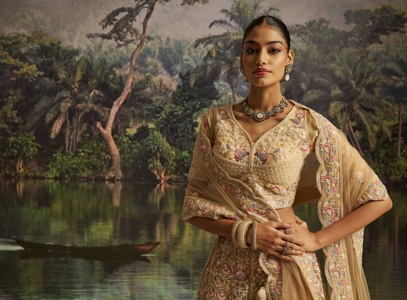 cream net embroidered lehenga choli with dupatta