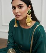 Gold plated kashmiri jhumka earrings with green kundan pearl drops & antique finish