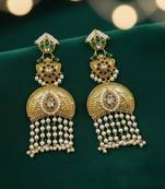 Gold plated kundan temple earrings with pearl tassels & green stone