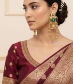 Gold plated kashmiri kundan pearl jhumka earrings with green stone & chain