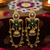 Gold plated kashmiri kundan pearl jhumka earrings with green stone & chain