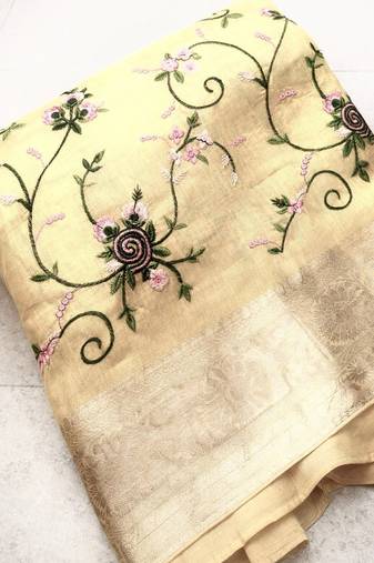 golden color floral tissue saree